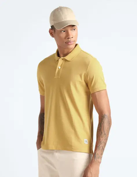 FLYING MACHINE  Men Solid Polo Neck Cotton Blend Yellow T-Shirt FMTSH6467